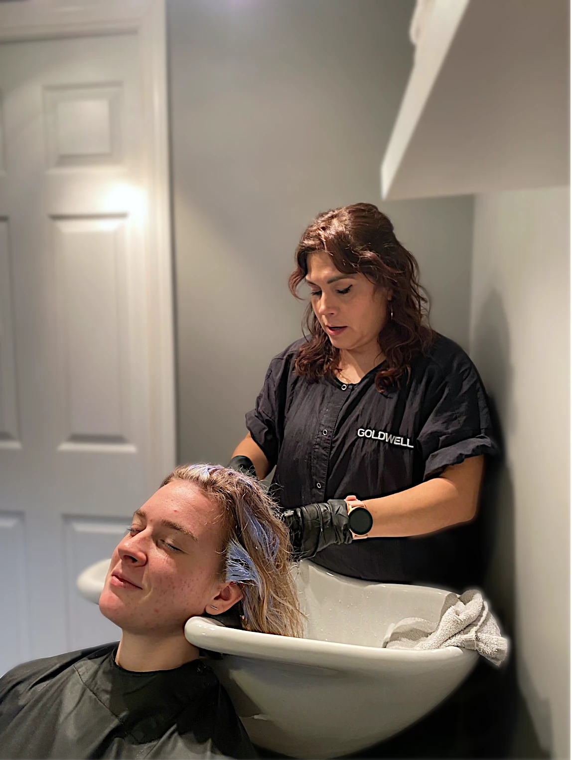 Zobeida styling a client's hair in her Kelowna salon